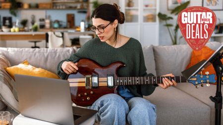 Female guitar teaches hosts an online lesson