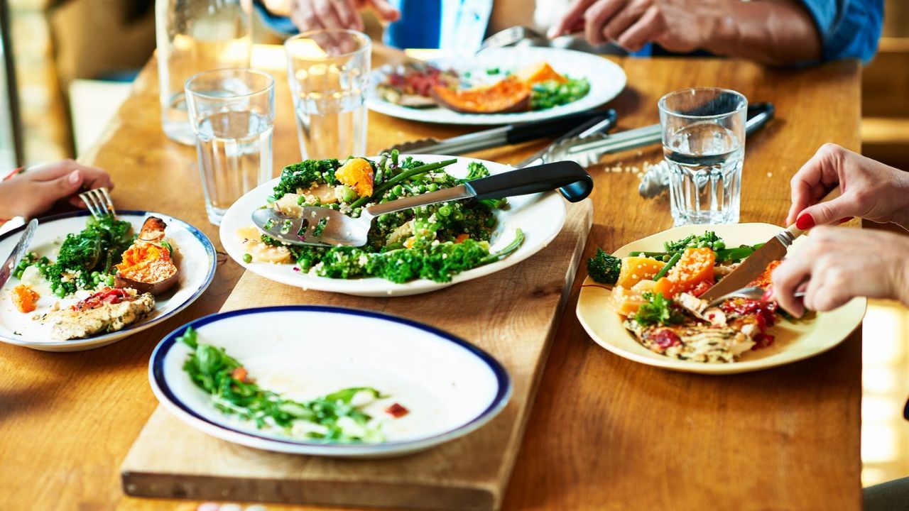 A family eating lunch from plates