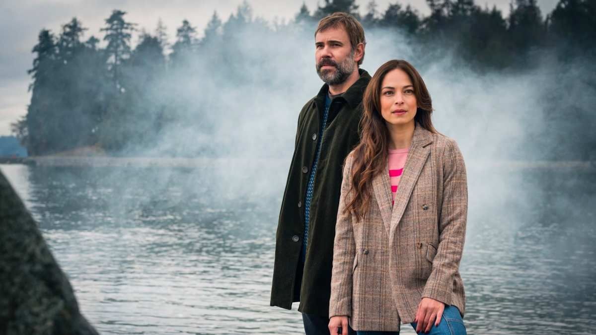 Rossif Sutherland (as Detective Karl Albert) and Kristin Kreuk (librarian Cassandra Mitchell) star in &quot;Murder in a Small Town&quot;