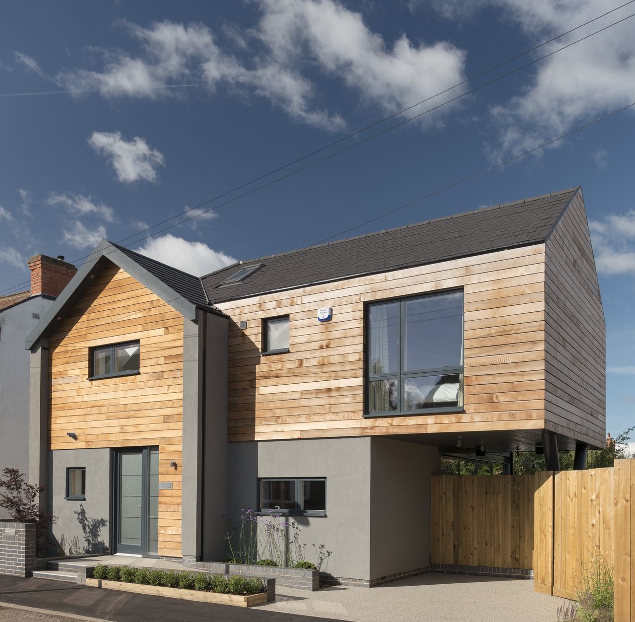 timber clad self build home with cantilever section