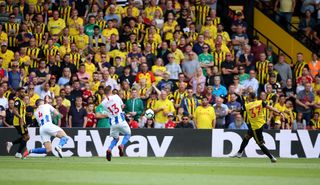 Roberto Pereyra, right, scores the first of his two goals against Brighton in last season's opener