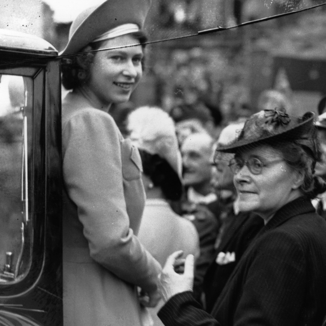 A black and white photo of Queen Elizabeth after VE Day in 1945
