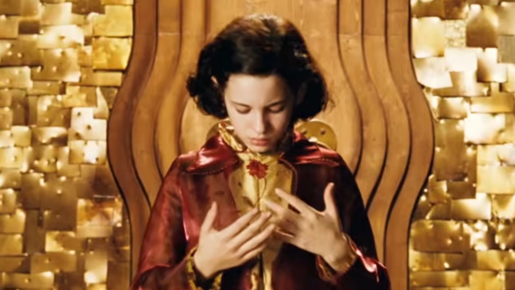 Ivana Baquero staring down at her hands in Pan's Labyrinth