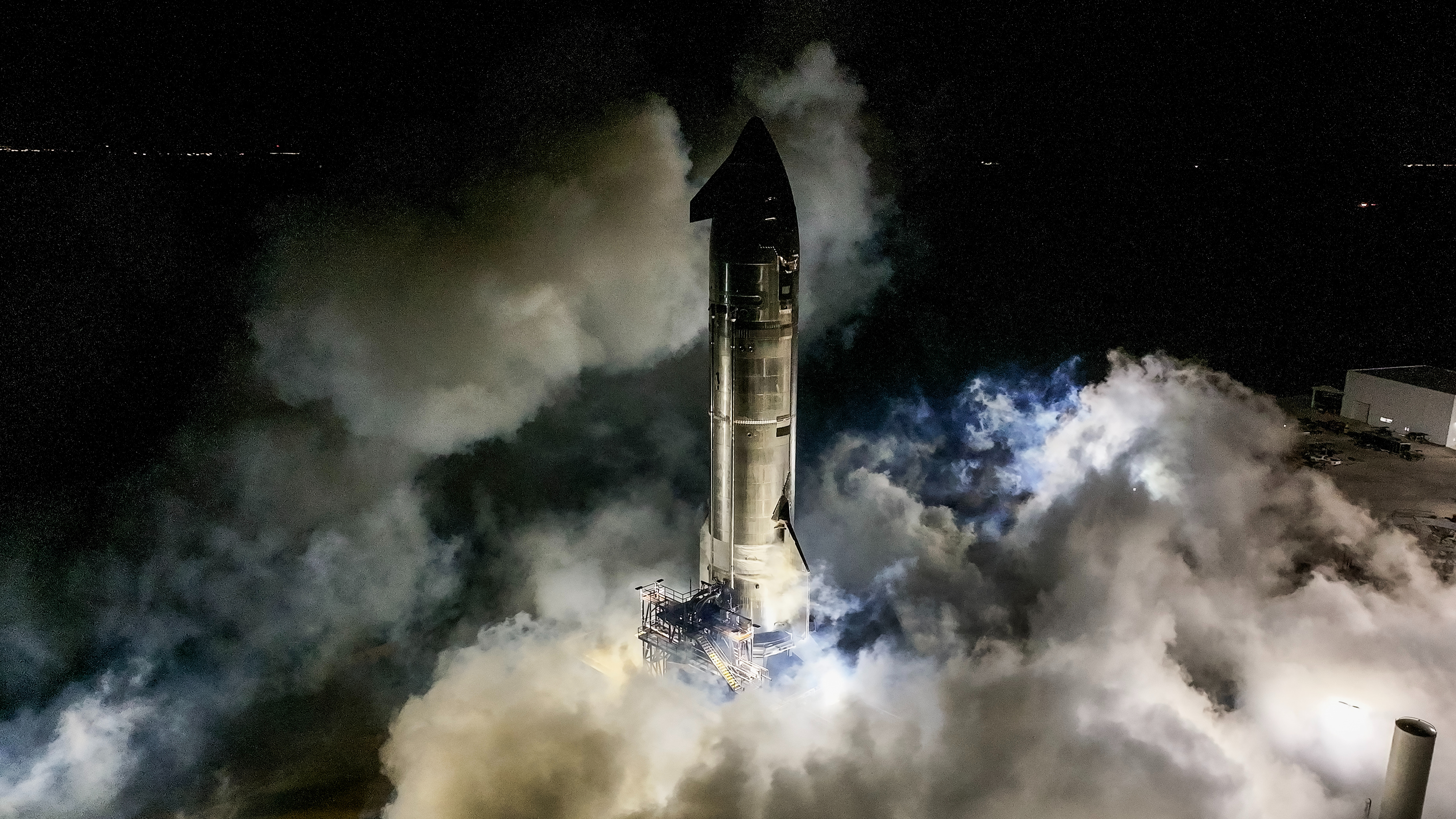 SpaceX test-fires a Starship upper stage ahead of Starship's upcoming ninth test flight. SpaceX shared this photo via X on May 1, 2025.