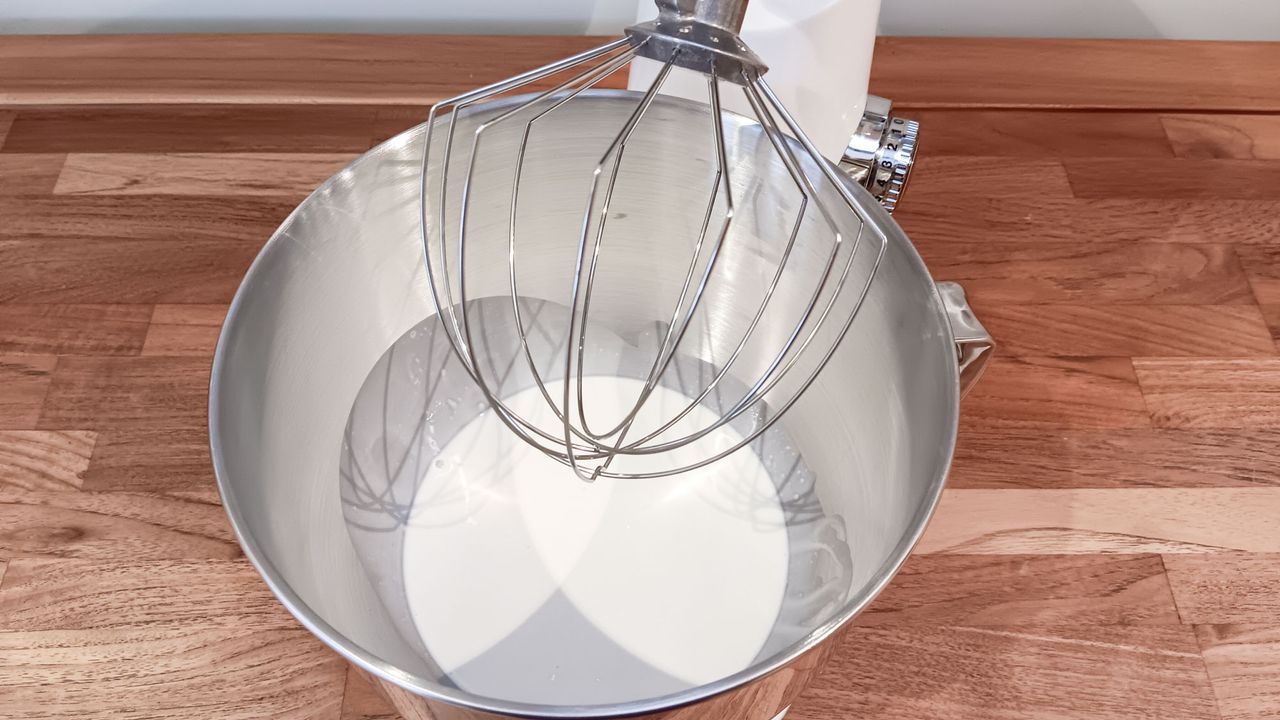 Cream ready to be whipped in a Cuisinart Precision stand mixer