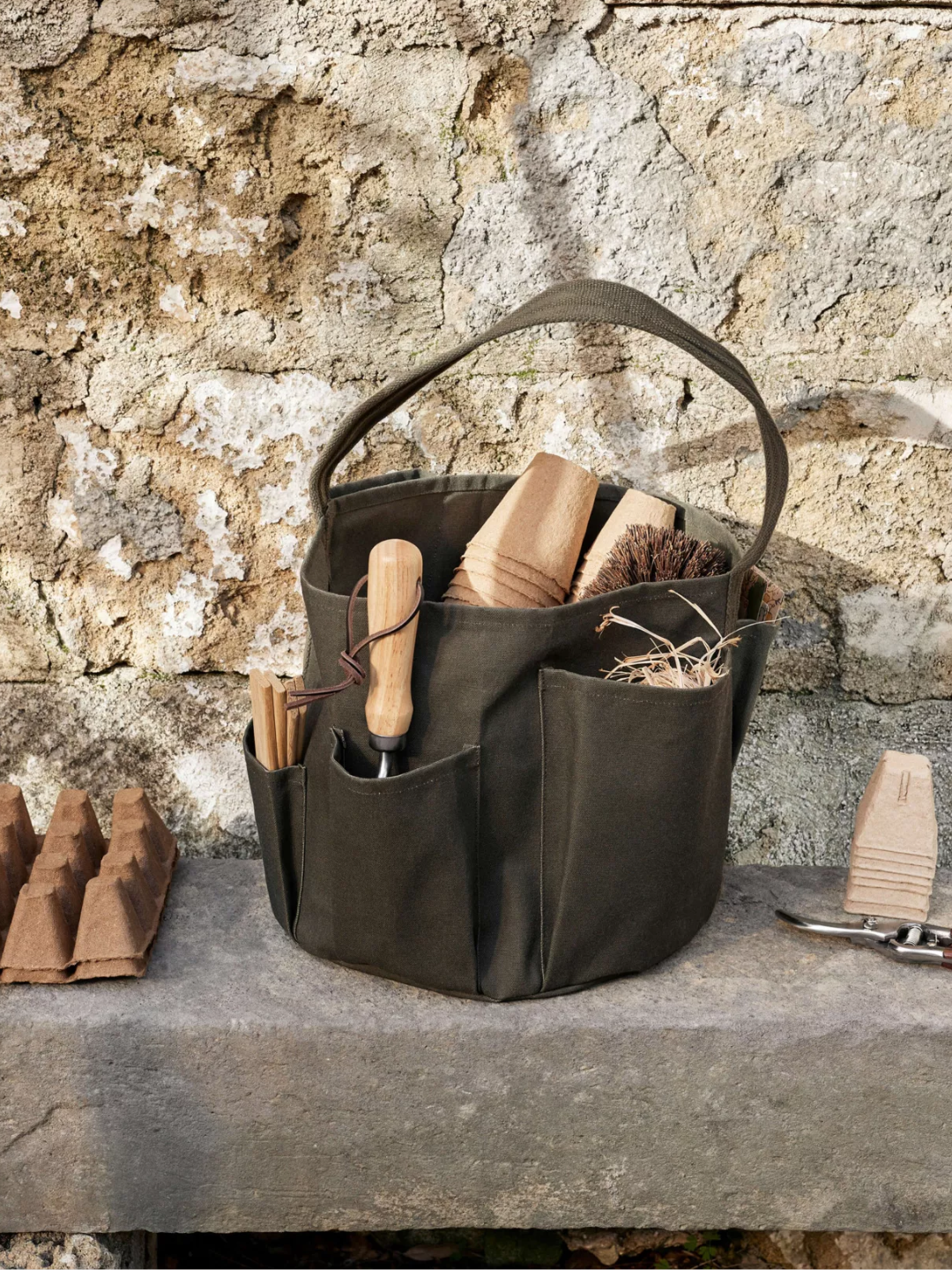 A dark green cotton garden bucket bag from Ferm Living