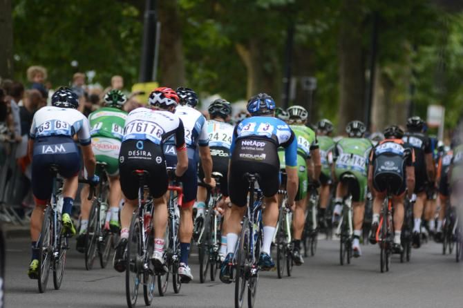 The bunch heads along the embankment