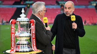 Manchester City manager Pep Guardiola speaks to Gary Lineker on the BBC after his side's FA Cup semi-final win over Chelsea at Wembley in April 2024.