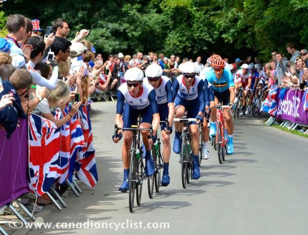 Bradley Wiggins leads the British chase over the top of the climb