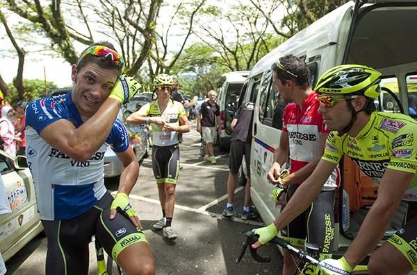 Andrea Guardini (left) prepares himself for another stage with some Farnese Vini teammates beneath the trees in Tasik Kenyir.