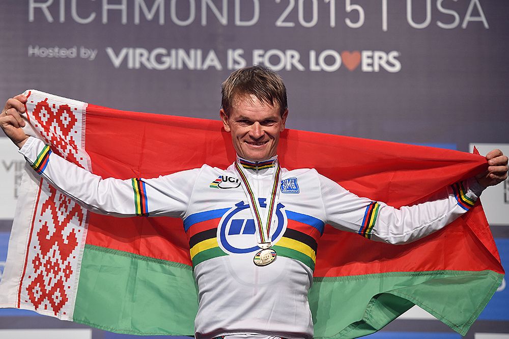Vasil Kiryienka (Belarus) drapes his nation's flag around his shoulders as the new world champion in the time trail