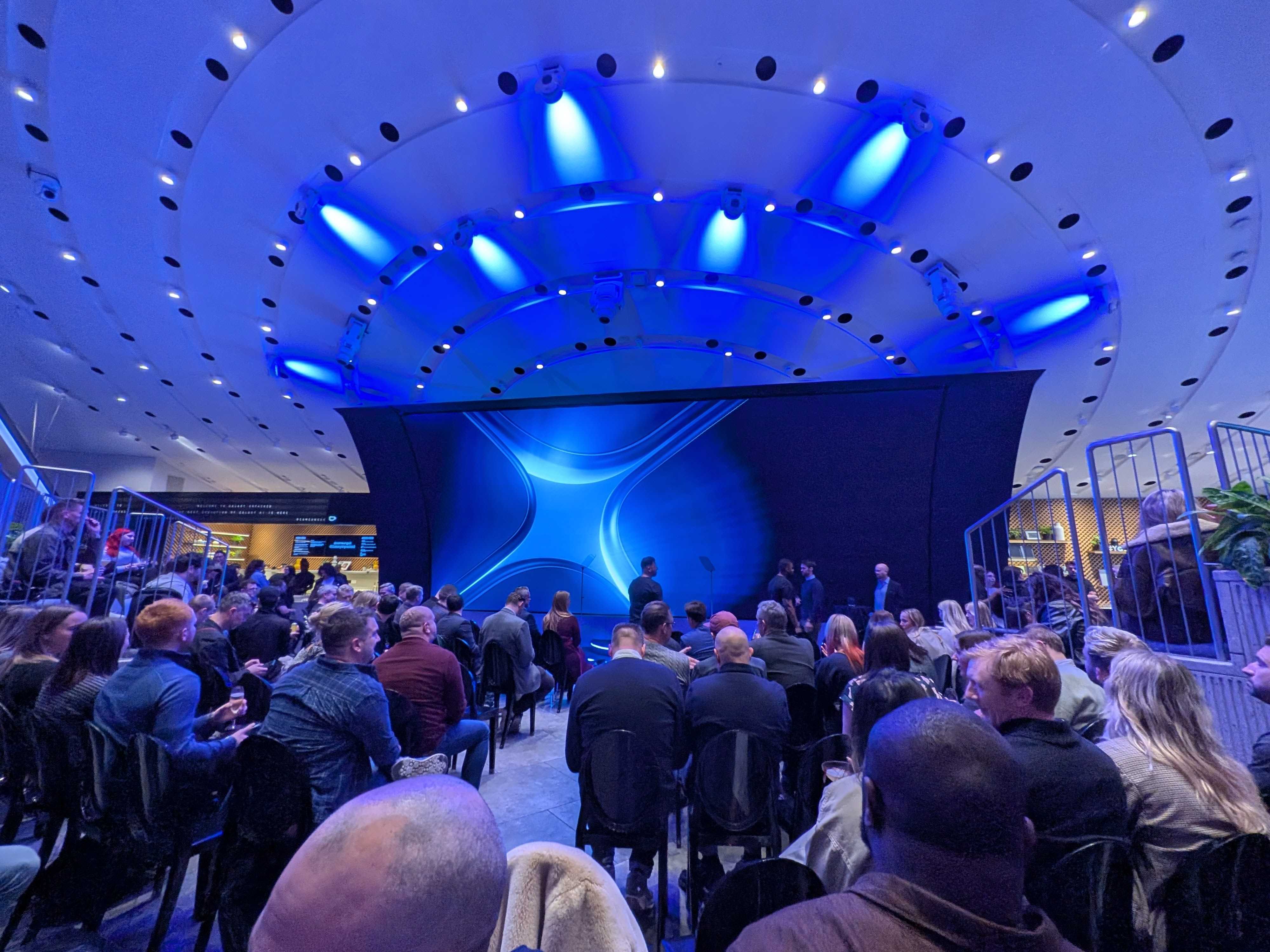 A room full of people at Samsung's KX London store, waiting for the start of the Galaxy S25 launch