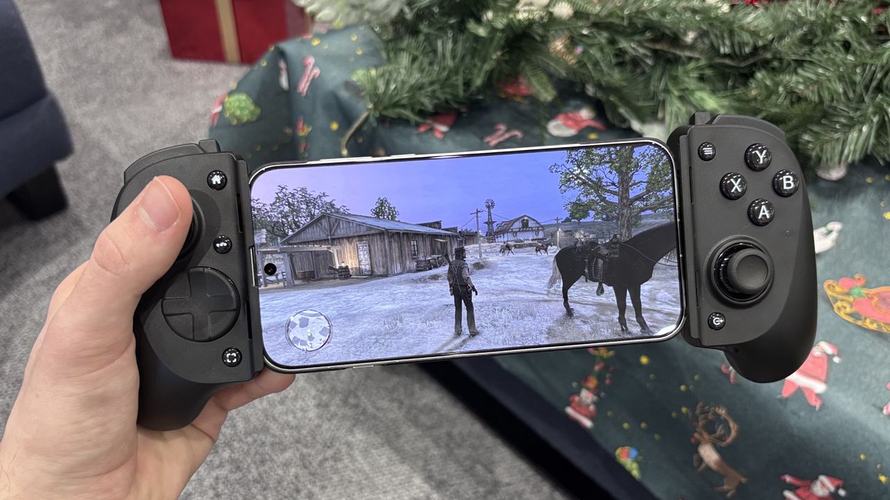 The Razer Kishi V3 Pro with a phone bracketed playing Red Dead Redemption