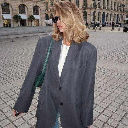 Saasha Burns wearing a grey blazer