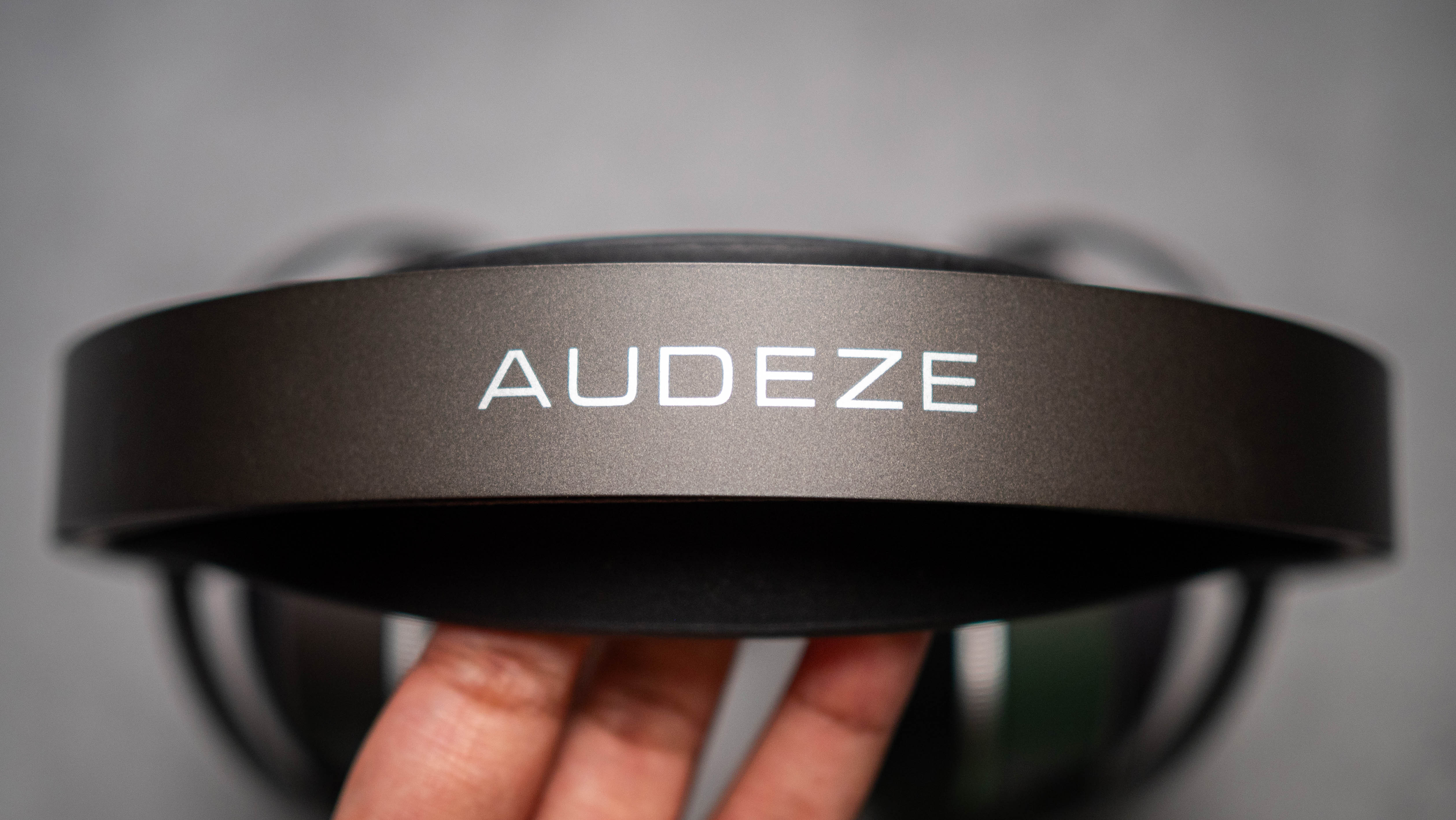 Audeze LCD-S20 planar headset in front of gray kraft sheet highlighting product design