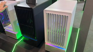 A photo of two Montech F738 Pro PC cases, as displayed at Computex 2026, with their front panel shutters partially open