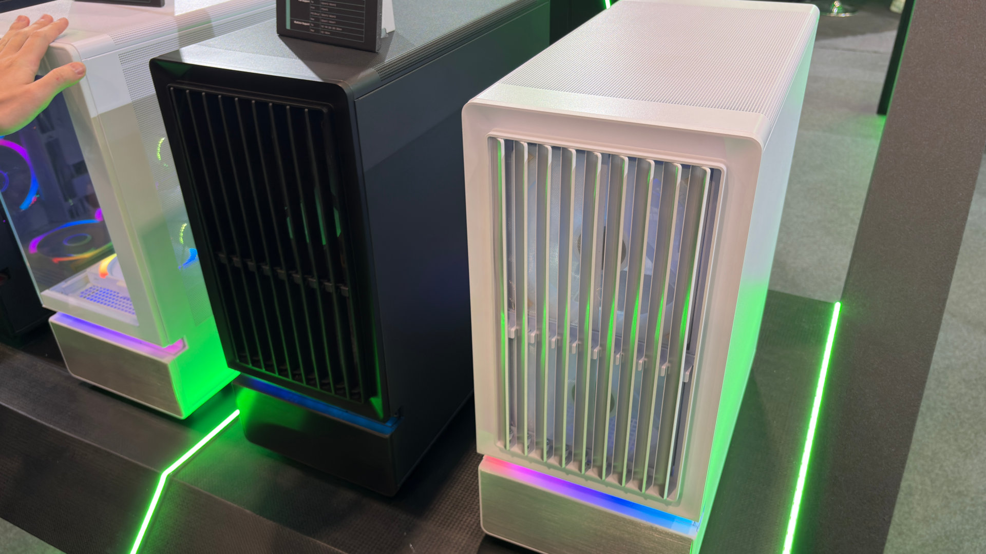 A photo of two Montech F738 Pro PC cases, as displayed at Computex 2026, with their front panel shutters partially open