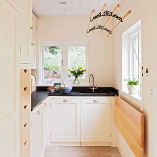 kitchen with cream wall and kitchen sink