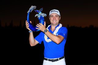 Justin Thomas holds the Tournament of Champions trophy after winning in 2020