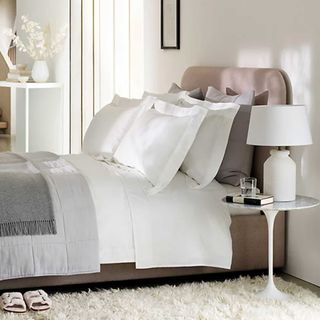 Quiet luxury bedroom with luxury white bedding on the bed