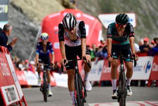 Team UAE Team Emirates Spanish rider Juan Ayuso Pesquera L and Team Boras Belgian rider Cian Uijtdebroeks cross the finish line of the stage 13 of the 2023 La Vuelta cycling tour of Spain a 1347 km race between Formigal and the Col du Tourmalet in France on September 8 2023 Photo by ANDER GILLENEA AFP Photo by ANDER GILLENEAAFP via Getty Images