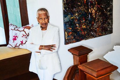 Collector Eileen Harris Norton in her 1906 Craftsman home in Santa Monica, with interiors by Nell Alano. In the background is Unfamiliar Money, 2019, a mixed media work on canvas by her friend, American artist Mark Bradford. All artworks courtesy of the E