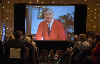 A picture of Fred Rogers on a screen