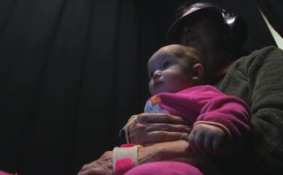 Each of the baby participants sat on his or her parent's lap while watching a screen. The parents wore headphones and a visor so as not to distract the little ones.