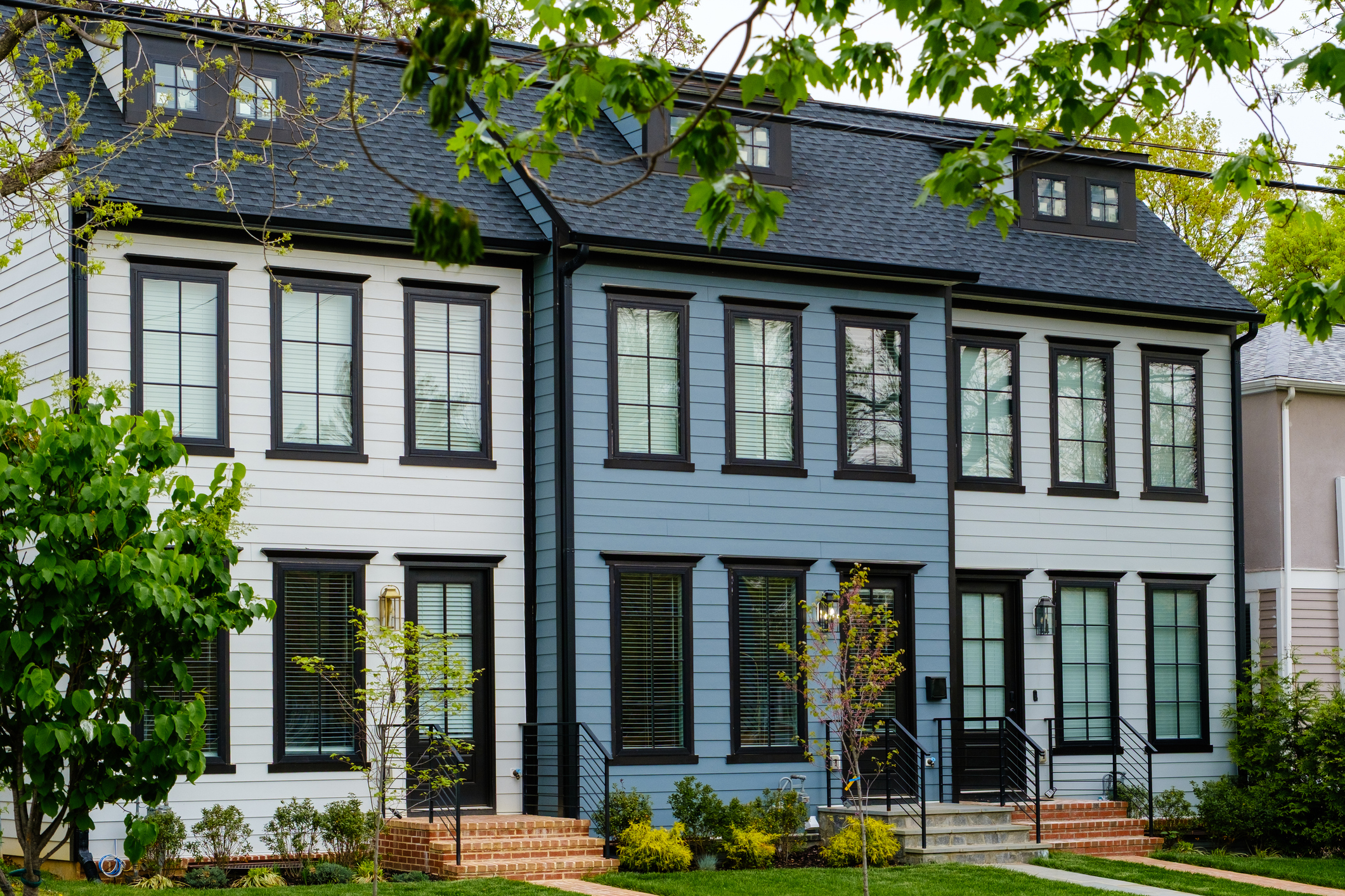 Row of newly constructed townhouses in a residential district