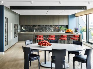 a modern kitchen with island seating