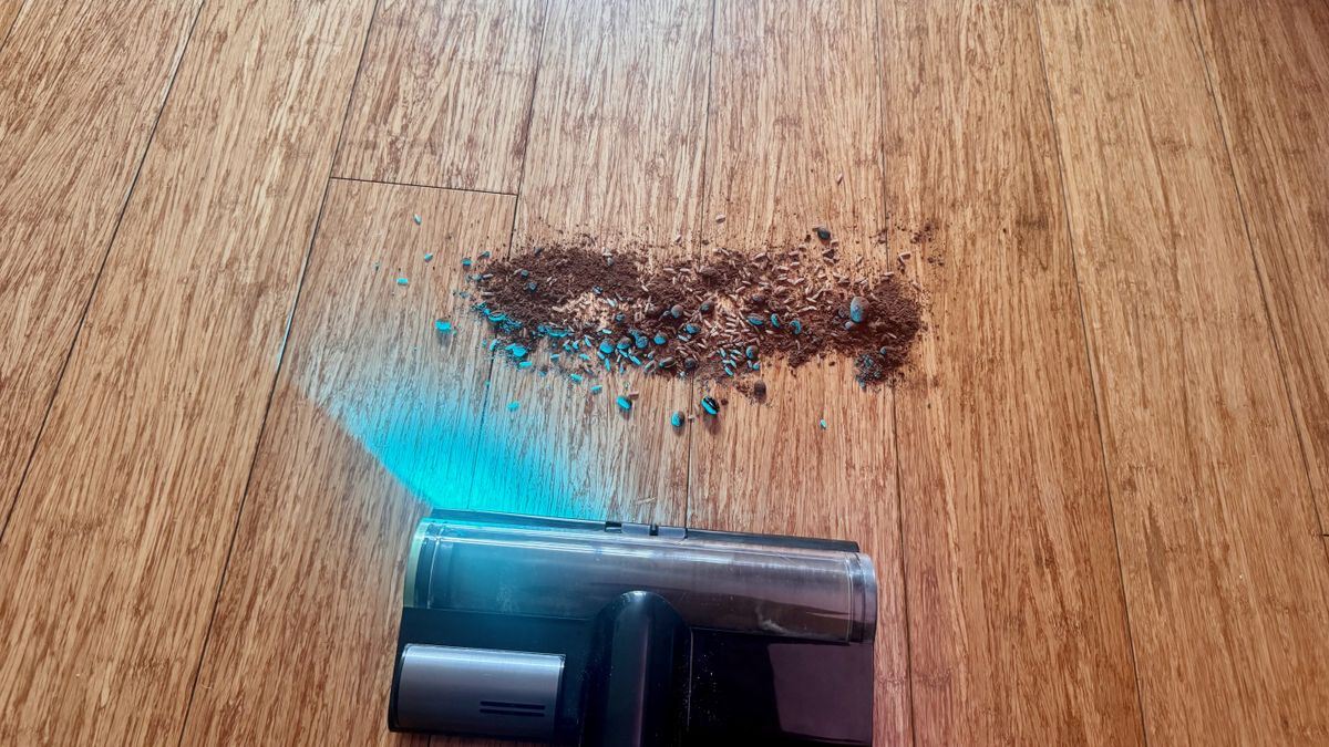 Debris spill being cleaned from hard floor
