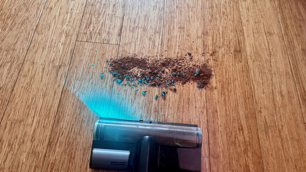 Debris spill being cleaned from hard floor