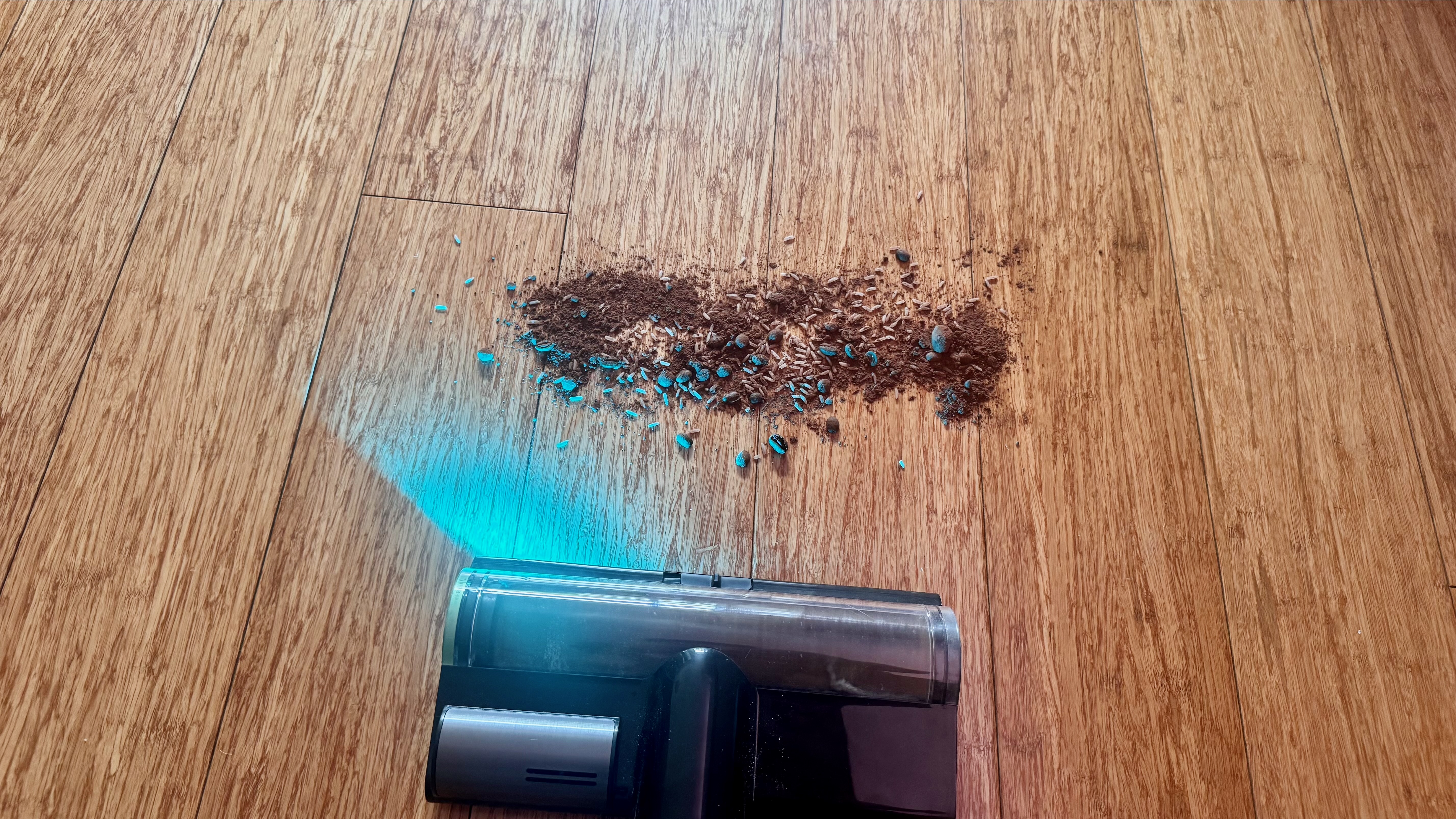 Debris spill being cleaned from hard floor