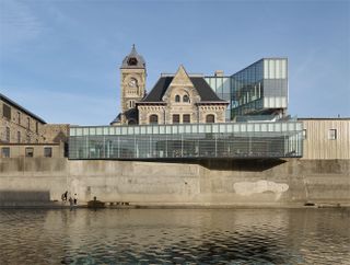 Idea Exchange is a glass addition to the Old Post Office in Ontario, Canada