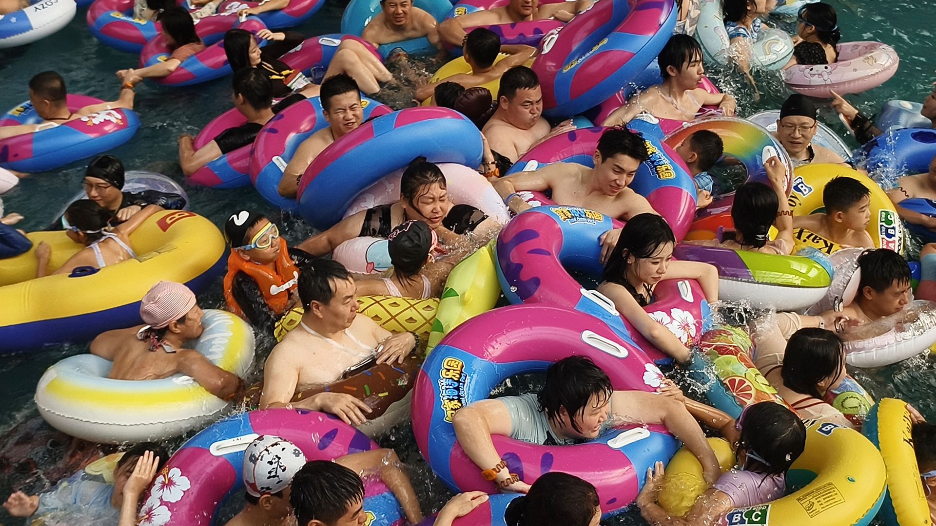 
                                People pack into a wave pool at an ocean park as they seek relief from the heat in Shenyang, China
                            