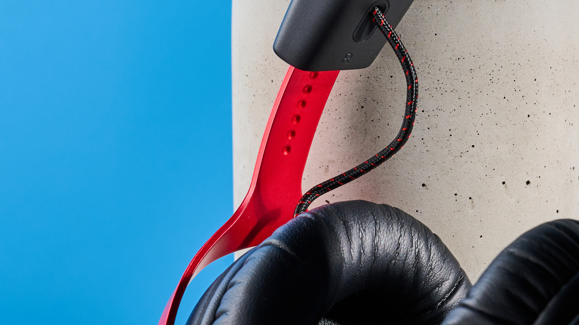 A black and red HyperX Cloud III S Wireless gaming headset