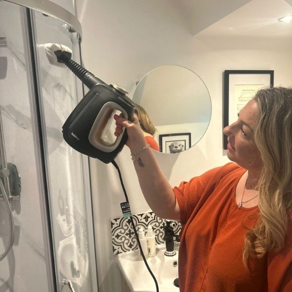 The Beldray 15-in-1 Steam Cleaner, in use by the tester in her bathroom.
