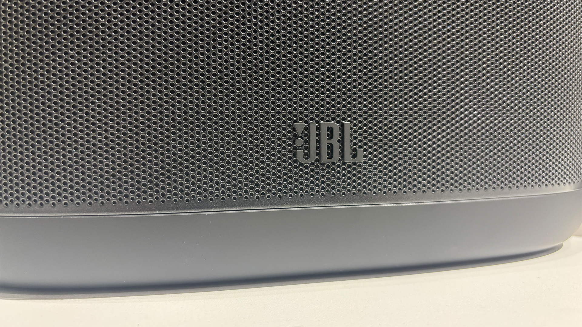 JBL Cove X1 multi-room wireless speaker detail of JBL logo