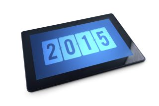 The number 2015 is displayed on a tablet computer.