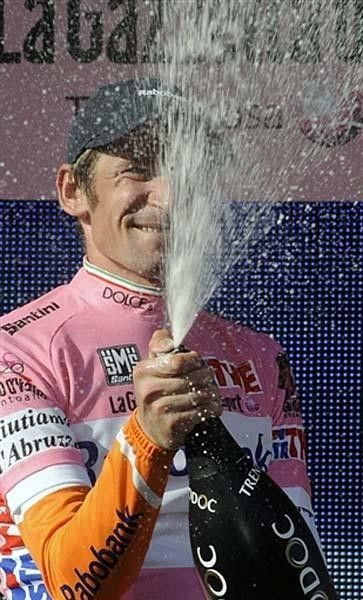 Denis Menchov (Rabobank) opens champagne.