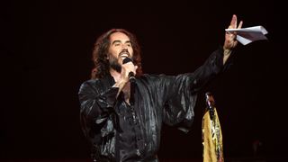 Russell Brand performing on stage