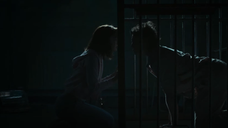 Lily-Rose Depp and George MacKay in cage in Wolf