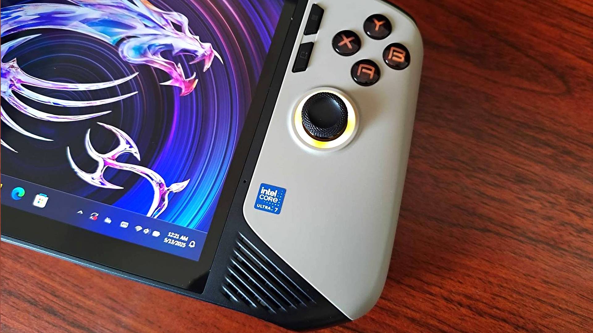 MSI Claw 8 AI+ handheld with close up of Intel Core badge on front.