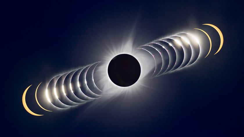 A composite image showing totality as the lunar disk hides the face of the sun. Images are stacked diagonally either side showing the moon and sun just before and after totality.