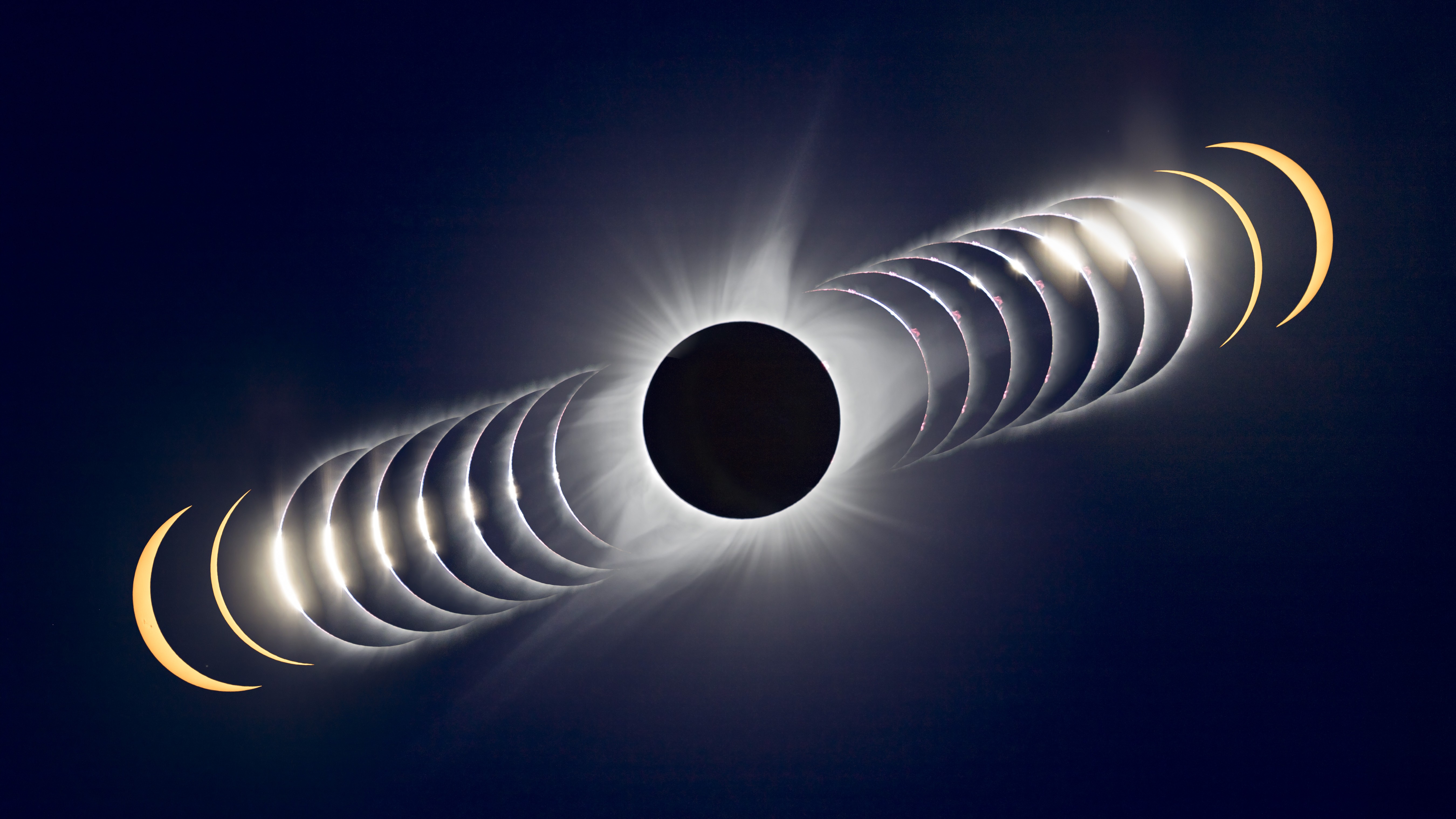 A composite image showing totality as the lunar disk hides the face of the sun. Images are stacked diagonally either side showing the moon and sun just before and after totality.