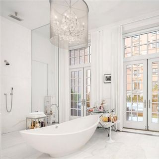 room with white walls white bathtub and shower