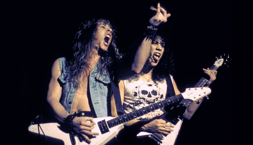 James Hetfield and Kirk Hammett performing live onstage, playing Gibson Flying V guitars, February 11, 1984 