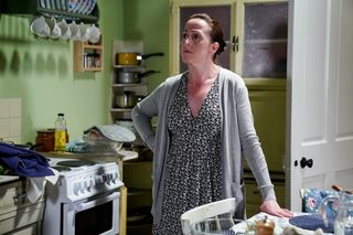 An angry Sonia Fowler with her hand on her hip in her kitchen