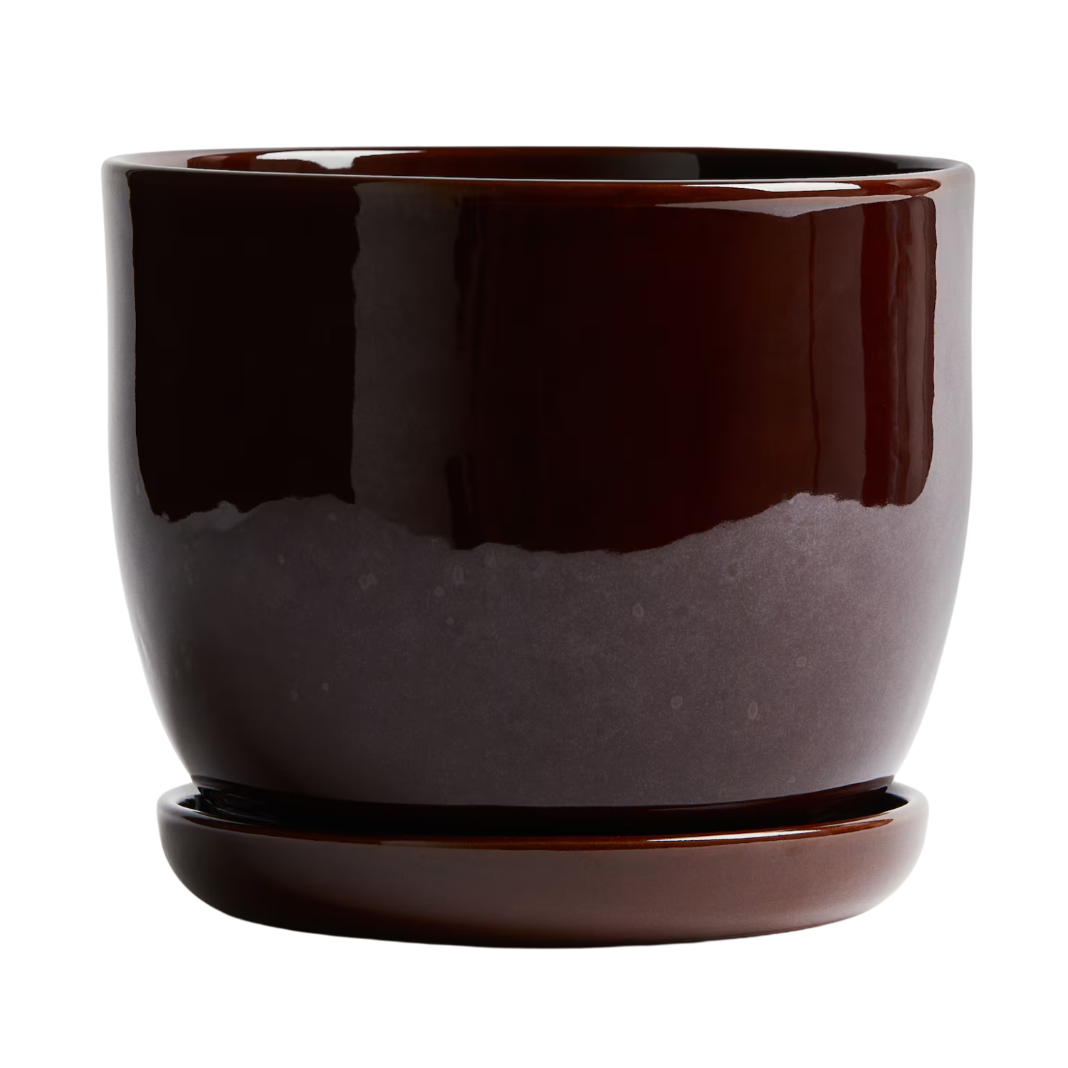 A terracotta plant and saucer set in dark brown glaze