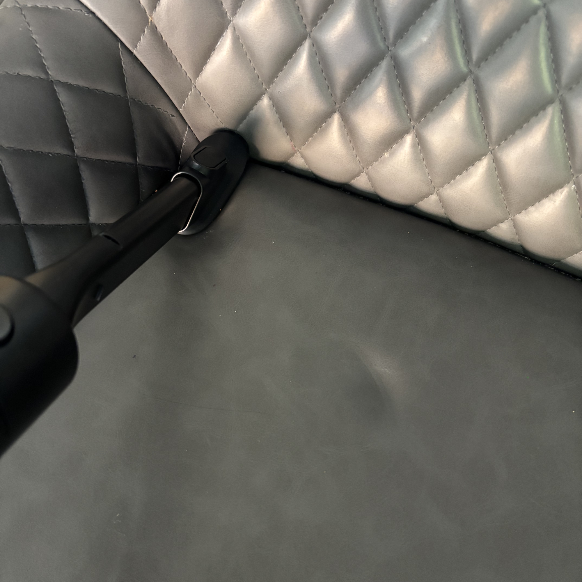 Dreame V20 Pro Cordless Stick Vacuum on grey breakfast stool